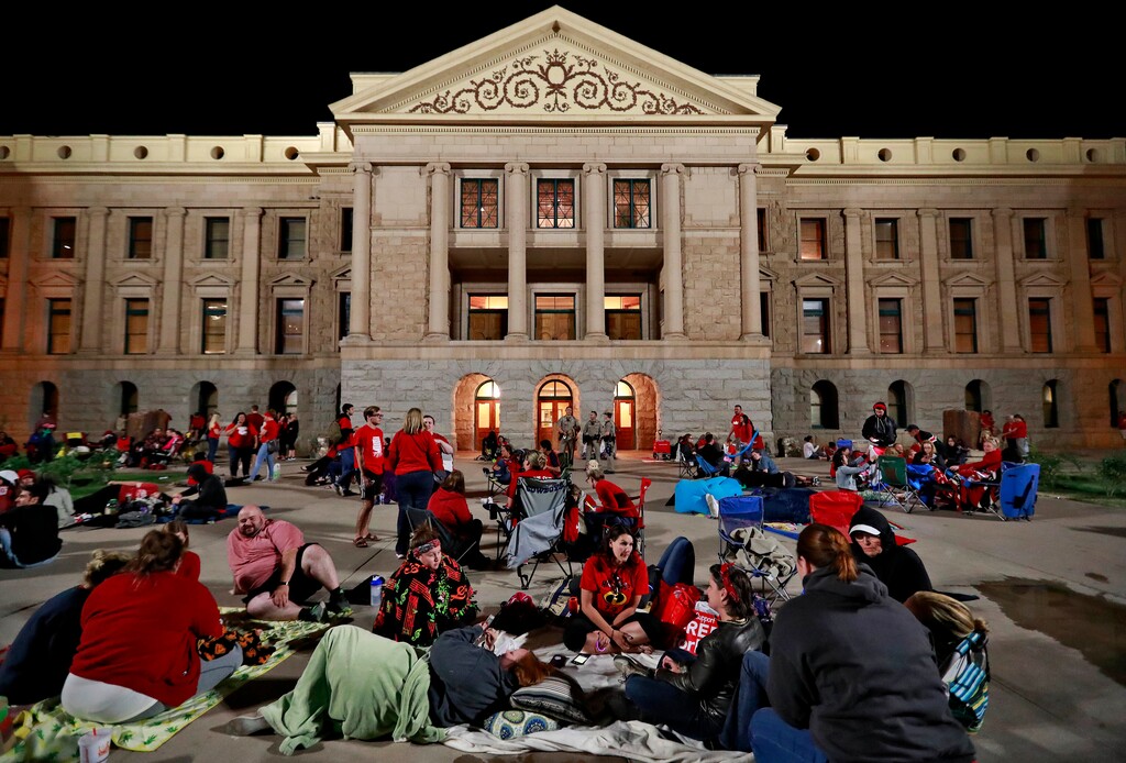(Matt York | The Associated Press) Teachers camp out as the Arizona legislature debates a budget negotiated by majority Republicans and GOP Gov. Doug Ducey Thursday, May 3, 2018, at the Capitol in Phoenix. The budget gives teachers big raises but falls short of their demands for better school funding. The teachers, in the sixth day of walk outs, have agreed to return to the classroom once the budget has been approved by the legislature.