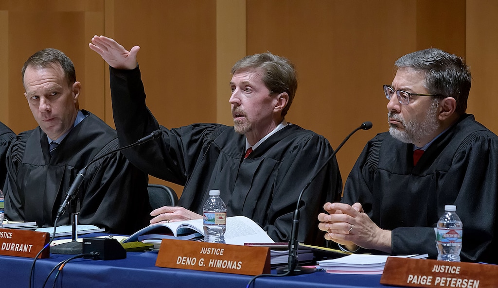 (Eli Lucero  |  Pool photo)  Chief Justice Matthew Durrant, center, asks a question as Associate Chief Justice Thomas Lee, left, and Justice Deno Himonas listen, during the oral arguments of State v. Van Huizen on Monday, March 19, 2018, in Logan. The Utah Supreme Court traveled to Utah State University to hear arguments in two cases followed by a Q&A with those in attendance.