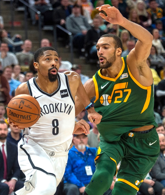 (Rick Egan  |  The Salt Lake Tribune)  Brooklyn Nets guard Spencer Dinwiddie (8) breaks to the basket as Utah Jazz center Rudy Gobert (27) defends, in NBA action between Utah Jazz and Brooklyn Nets, at  Vivint Smart Home Arena, Saturday, March 17, 2019.



