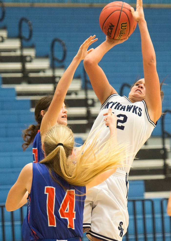 Rick Egan  |  The Salt Lake TribuneSalem Hills forward Lauren Gustin (12) takes a shot for the Skyhawks, in State Basketball Playoff action, The Salem Hills Skyhawks vs. The Timpview Thunderbirds, in Taylorsville, February 22, 2016.
