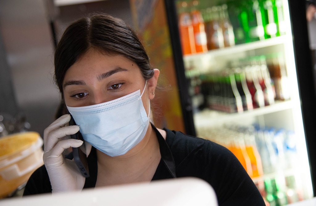 (Francisco Kjolseth  |  Tribune file photo) Valeria Garcia takes an order for pickup at La Casa Del Tamal Mexican Restaurant in West Valley City in September 2020. Takeout is expected to remain popular even as cases of the coronavirus decrease.