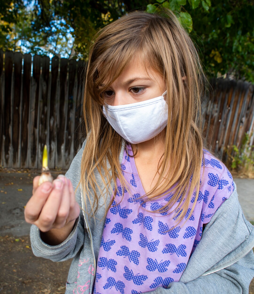 (Rick Egan  |  The Salt Lake Tribune)     Juliet Schiess, 10, checks out a plant she found on the property of an old drug store on 200 South in Salt Lake, on Friday, Oct. 23, 2020.