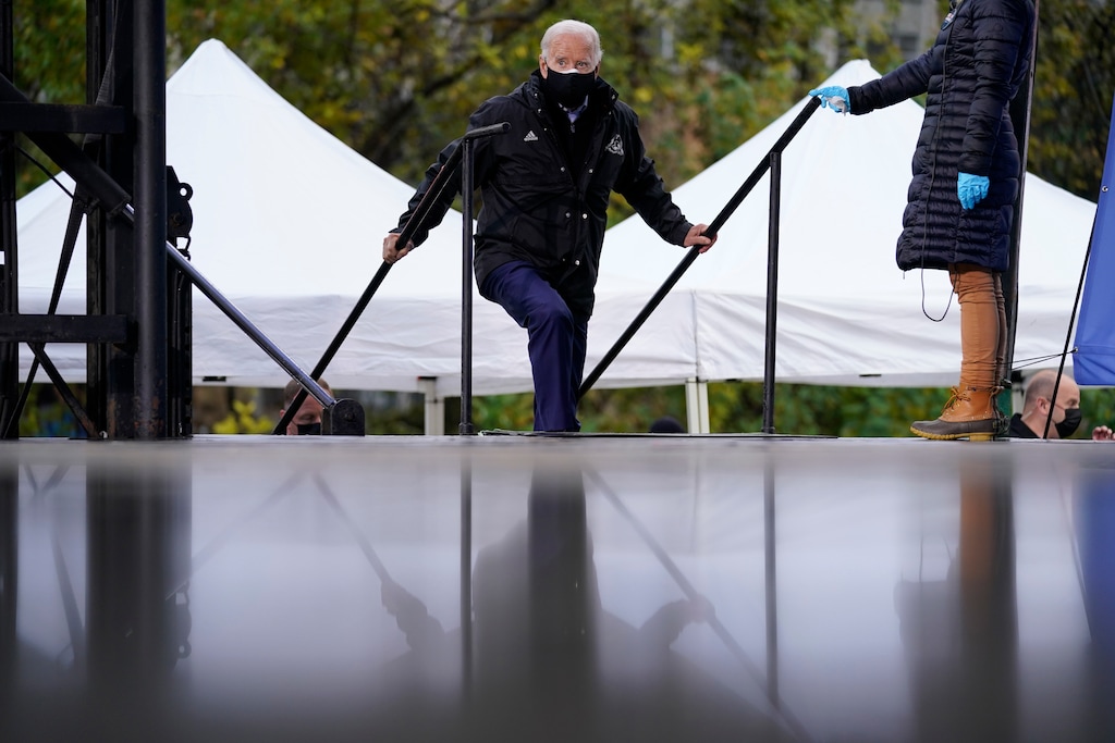 (Andrew Harnik | AP)  Democratic presidential candidate and former Vice President Joe Biden arrives to speak at a "Souls to the Polls" drive-in rally at Sharon Baptist Church, Sunday, Nov. 1, 2020, in Philadelphia.