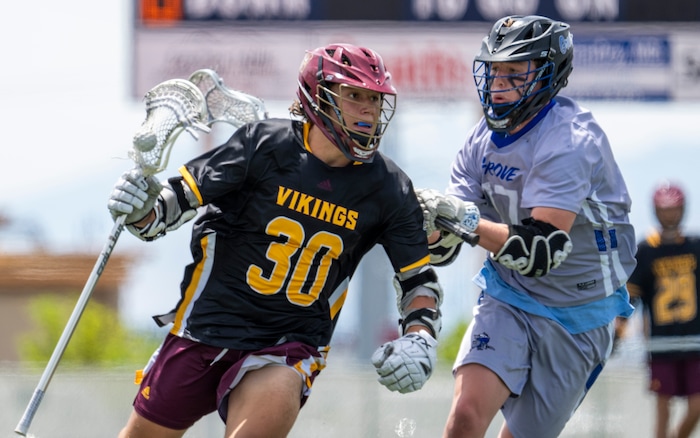 (Rick Egan | The Salt Lake Tribune) Mason Hepworth Viewmont, runs with the ball, as Kolton Bayles defends for Pleasant Grove, in the Division C championship game between the Viewmont Vikings and the Pleasant Grove Vikings, in Layton, on Saturday, May 29, 2021.