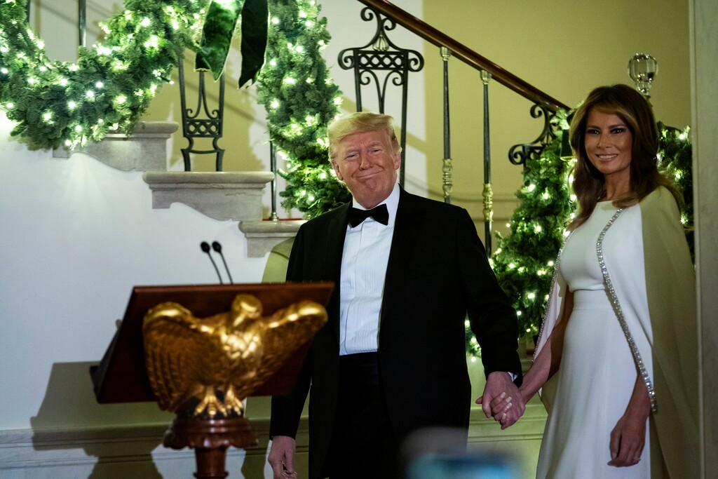 (Al Drago |The New York Times) President Donald Trump and first lady Melania Trump arrive to the Congressional Ball at the White House in Washington, Dec. 12, 2019. "Another wild week for the president, but does it lead to rejection or re-election," writes Maureen Dowd.