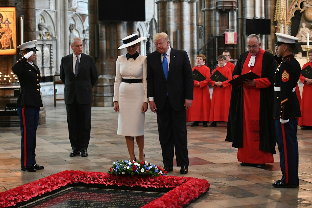 U.S President Donald Trump, accompanied by his wife Melania and Britain's Prince Andrew, second left, places a wreath on the Grave of the Unknown Warrior during a tour of Westminster Abbey in central London, Monday, June 3, 2019. Trump is on a three-day state visit to Britain. (Stefan Rousseau/Pool Photo via AP)