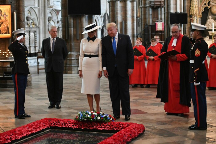 U.S President Donald Trump, accompanied by his wife Melania and Britain's Prince Andrew, second left, places a wreath on the Grave of the Unknown Warrior during a tour of Westminster Abbey in central London, Monday, June 3, 2019. Trump is on a three-day state visit to Britain. (Stefan Rousseau/Pool Photo via AP)