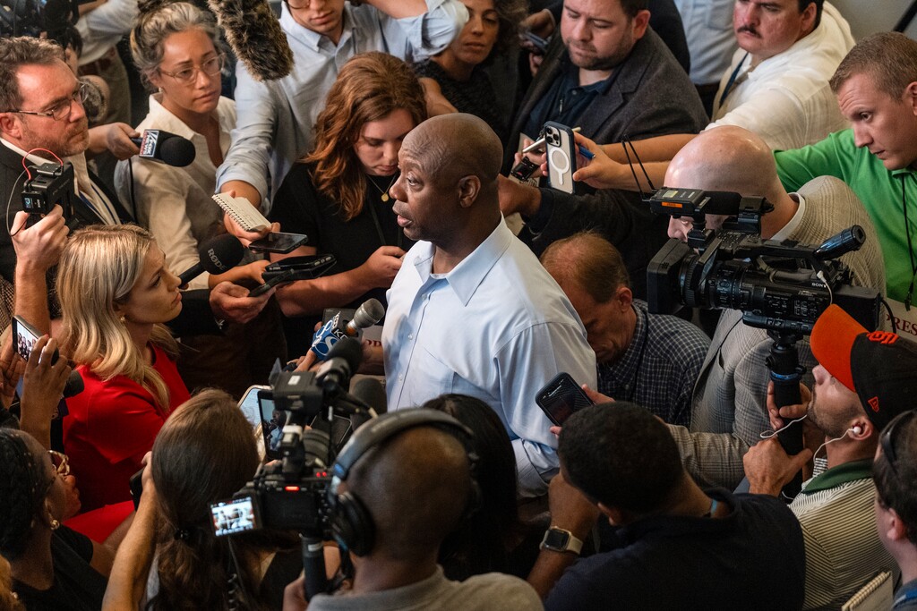 Republican presidential candidate Sen. Tim Scott (R-S.C.) speaking with reporters at a town hall event in Ankeny, Iowa on Thursday, July 27, 2023. The worst news for fellow Republican presidential candidate Gov. Ron DeSantis (R-Fla.) this past week was new polls out of Iowa, showing Scott creeping up on him, with around 10 percent support, to the governor’s roughly 15 percent, Ross Douthat writes. (Jordan Gale/The New York Times)