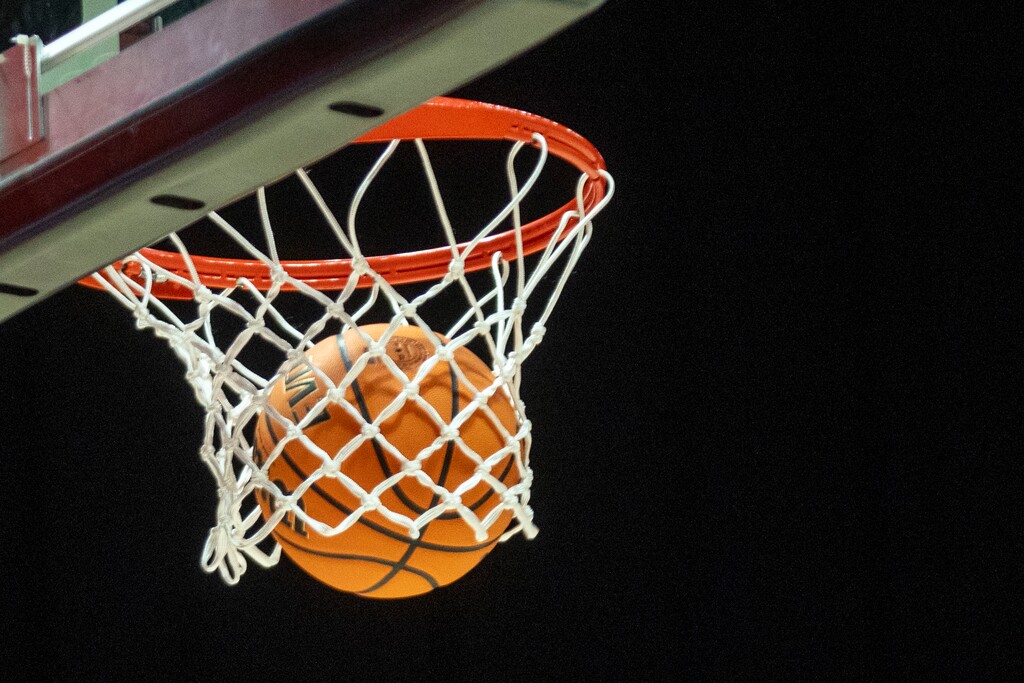 (Rick Egan | The Salt Lake Tribune) A basketball goes through the net during the 2026 Utah high school basketball playoffs at the Huntsman Center.