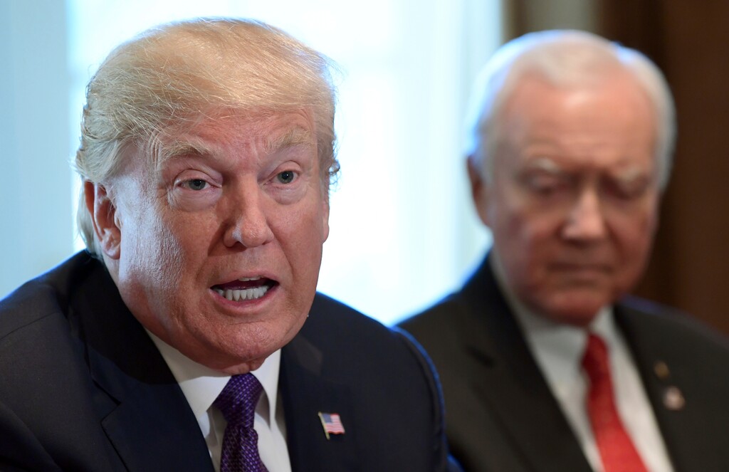 (Susan Walsh | AP file photo) President Donald Trump, left, sitting next to Senate Finance Committee Chairman Sen. Orrin Hatch, R-Utah, right, speaks during a meeting of the committee and members of the President's economic team in the Cabinet Room of the White House in Washington, Oct. 18, 2017.