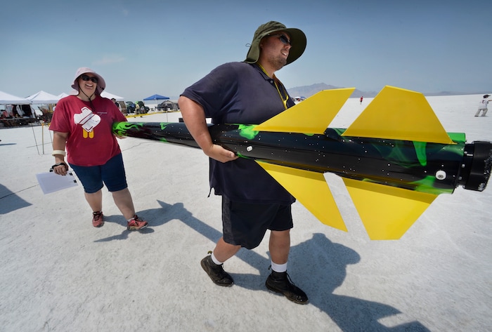 (Scott Sommerdorf   |  The Salt Lake Tribune)   Travis and Kelly Tabbal take their "Fireball" rocket out to the launch pad during "Hellfire" - the four-day event sponsored by the Utah Rocket Club on Saturday, Aug. 5, 2017.