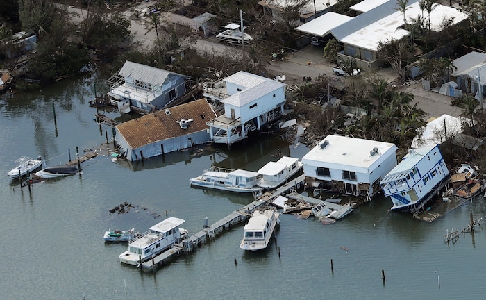 Damaged homes sit in the aftermath of Hurricane Irma on Tuesday, Sept. 12, 2017, in Key West, Fla. (AP Photo/Chris O'Meara)