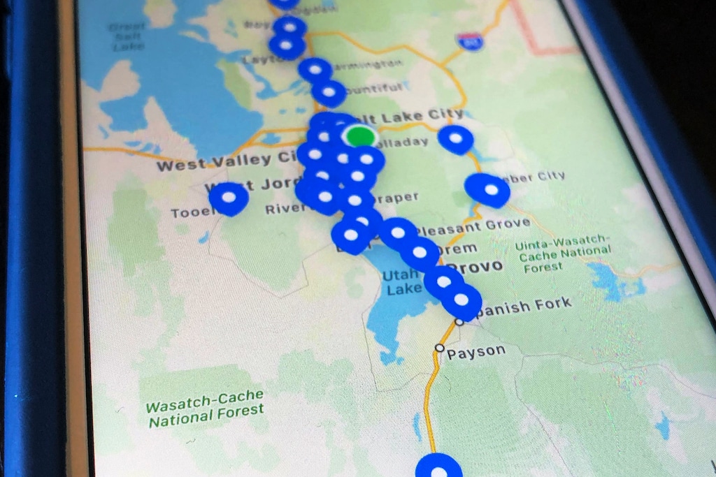 (Lindsay Whitehurst | AP) This April 28, 2020, photo shows a smartphone app built for the state of Utah displaying coronavirus test sites. The app tracks symptoms and shares location data for contact tracing, the process of determining who might have been exposed to the virus. The app is “a tool to help jog the memory of the person who is positive so we can more readily identify where they’ve been, who they’ve been in contact with, if they choose to allow that,” said Angela Dunn, Utah’s state epidemiologist.