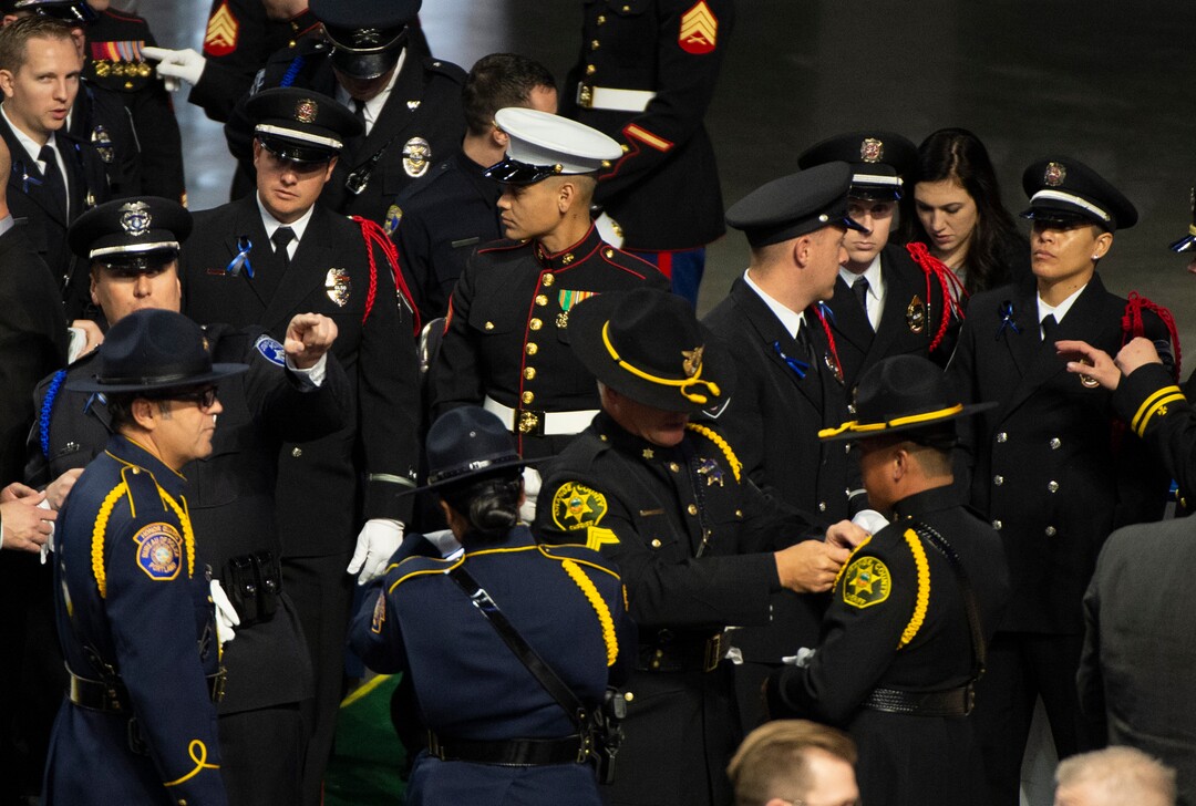 (Rick Egan  |  The Salt Lake Tribune)     Police officers from around the State of Utah gather for the funeral for South Salt Lake police officer, David Romrell, at the Maverik Center, in West Valley City, Wednesday, Dec. 5, 2018.