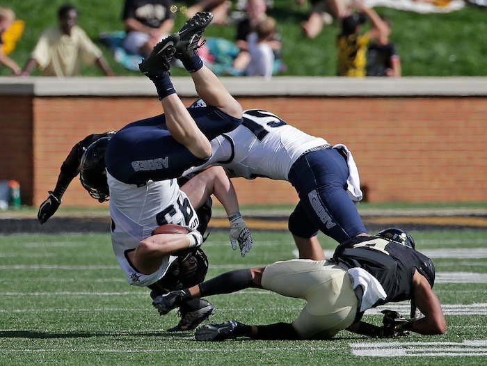 Utah State's Jacoby Wildman (93) is upended by Wake Forest's Amari Henderson (4) after running for a first down on a fake punt in the first half of an NCAA college football game in Winston-Salem, N.C., Saturday, Sept. 16, 2017. (AP Photo/Chuck Burton)