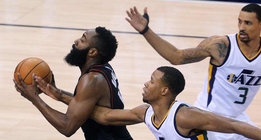 Steve Griffin / The Salt Lake TribuneUtah Jazz guard Rodney Hood (5) tries to reach for the ball as Houston Rockets guard James Harden (13) streaks to the basket during the Utah Jazz versus Houston Rockets NBA game at Vivint Smarthome Arena in Salt Lake City Tuesday November 29, 2016. 