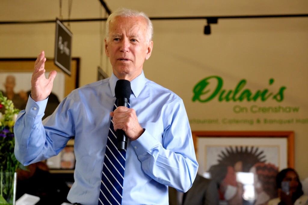 (Richard Vogel | AP file photo) In this July 18, 2019 photo, Democratic presidential candidate former Vice President Joe Biden, talks to community faith leaders during a visit to Dulan's soul food on Crenshaw in Los Angeles. Biden’s campaign is preparing to roll out an array of new religious outreach efforts that aim to speak specifically to a variety of devout voters. The Biden team's programs come on the heels of the GOP’s own faith-heavy presidential nominating convention.