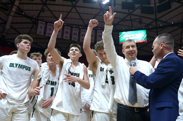 (Leah Hogsten | The Salt Lake Tribune) Olympus celebrates the win. Olympus defeated Corner Canyon 76-49 to win the 5A High School Boys’ Basketball Tournament Championship at the Jon M. Huntsman Center in Salt Lake City, Saturday, March 3, 2018.