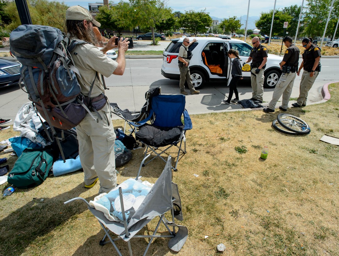 (Steve Griffin  |  The Salt Lake Tribune)  UHP Troopers make an arrest on 500 west as law enforcement officers from several agencies increase their presence in the Rio Grande homeless area in Salt Lake City Monday August 14, 2017.