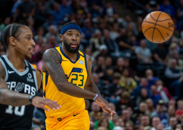 (Rick Egan  |  The Salt Lake Tribune)    
Utah Jazz forward Royce O'Neale (23) throws a pass to Utah Jazz guard Donovan Mitchell (45), but got the ball back to score on a fast break, in NBA action between the Utah Jazz and the San Antonio Spurs, in Salt Lake City, Friday, Feb. 21, 2020.