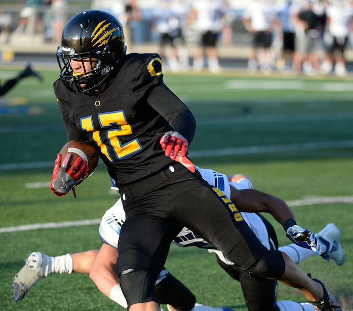 (Francisco Kjolseth  |  The Salt Lake Tribune)  Orem's Puka Nacua slips past the Bingham defense during the first half of the season's start Thursday, Aug. 16, 2018 in Orem.