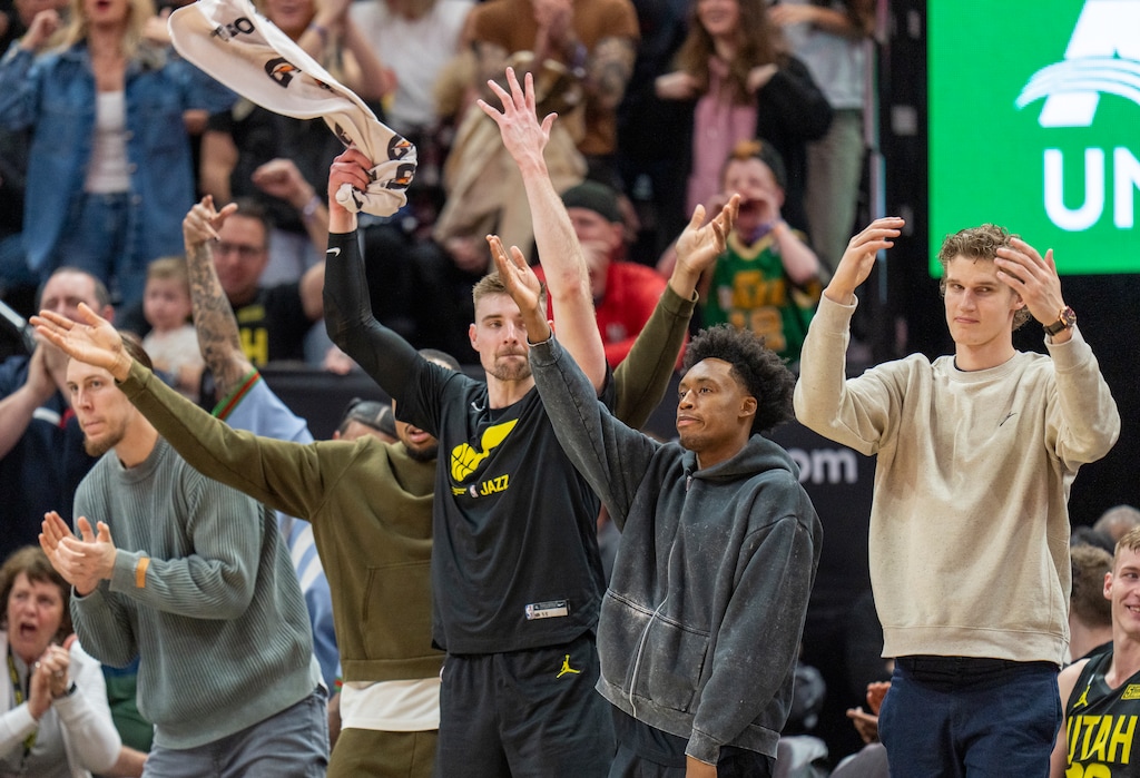 (Rick Egan | The Salt Lake Tribune) in The Jazz bench try to get the crowd on their feet as the Jazz take the lead in the final minutes of the game, in NBA action between the Utah Jazz and the Denver Nuggets at Vivint Arena,  Saturday, April 8, 2023.