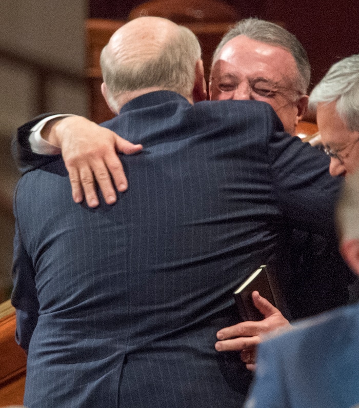 (Rick Egan  |  The Salt Lake Tribune)          Elder Dale G. Renlund hug Elder Ulisses Soares, after the Saturday morning session of the188th Annual General Conference in Salt Lake City,  Saturday, March 31, 2018.