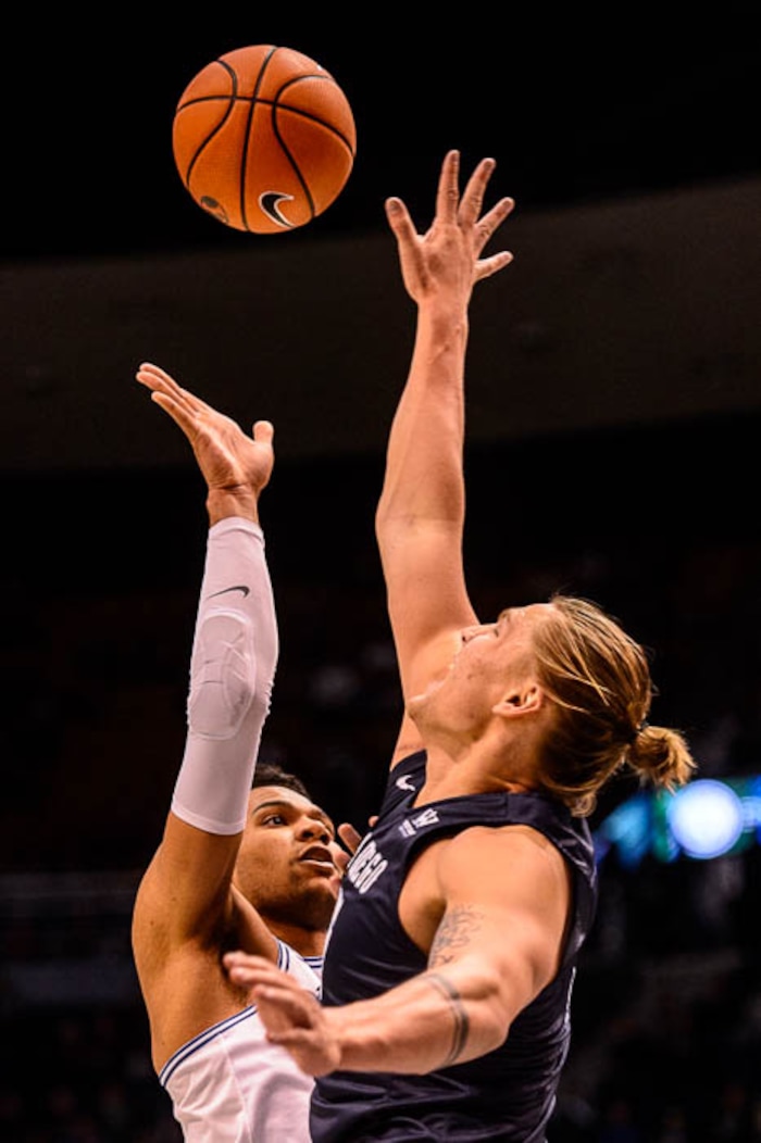 (Trent Nelson | The Salt Lake Tribune)   Brigham Young Cougars forward Yoeli Childs (23) shoots over San Diego Toreros forward Alex Floresca (15) as BYU hosts San Diego, NCAA basketball in Provo Saturday January 20, 2018.
