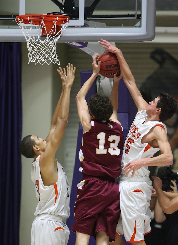 (Steve Griffin  |  Tribune File Photo)  Brighton's Travis Devashrayee blocks the shot of Viewmont's McKay Johnson during 5A state basketball game against at the Dee Events Center in Ogden, Utah Wednesday February 27, 2013.