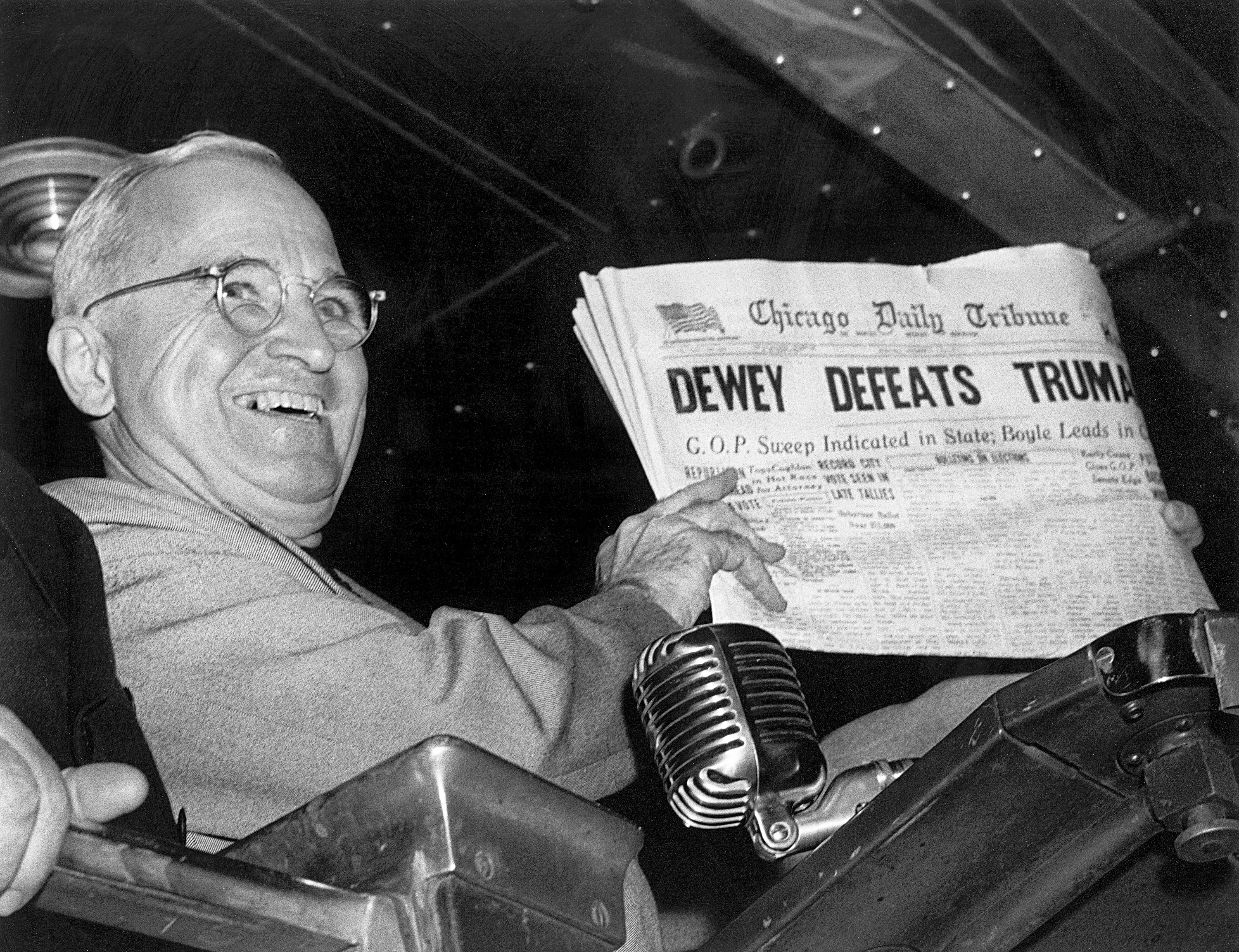 (Byron Rollins | AP file photo) In this Nov. 4, 1948, file photo, President Harry S. Truman at St. Louis' Union Station holds up an election day edition of the Chicago Daily Tribune, which — based on early results — mistakenly announced "Dewey Defeats Truman."
