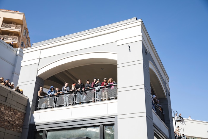 (Clark Clifford  |  Special to The Salt Lake Tribune) People crowd balconies of Olympic Plaza trying to get a better view of Kanye West's Sunday Service at The Gateway in Salt Lake City on Saturday, Oct. 5, 2019.