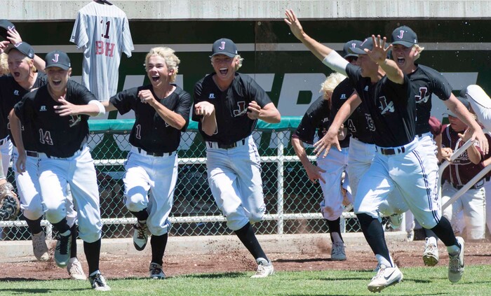 (Rick Egan  |  The Salt Lake Tribune)   Jordan High celebrates their 11-1 win over Olympus, for the 5A state baseball championship, at UVU in Orem, Friday, May 25, 2018.
