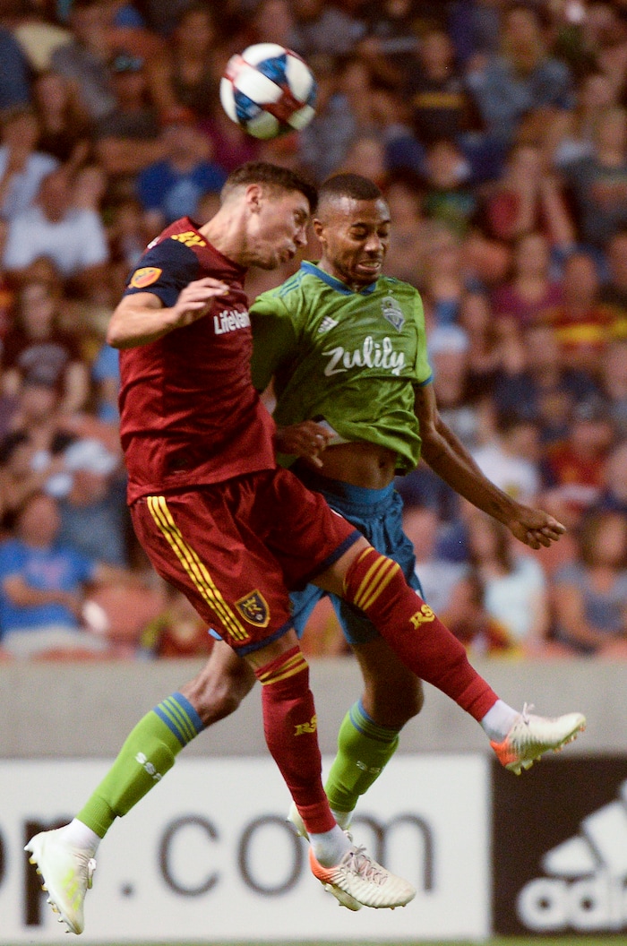 (Leah Hogsten  |  The Salt Lake Tribune) Real Salt Lake midfielder Damir Kreilach (8) and Seattle Sounders defender Saad Abdul-Salaam (12) take a header as Real Salt Lake hosts the Seattle Sounders, Aug. 14, 2019, at Rio Tinto Stadium in Sandy. RSL defeated the Sounders 3-0.