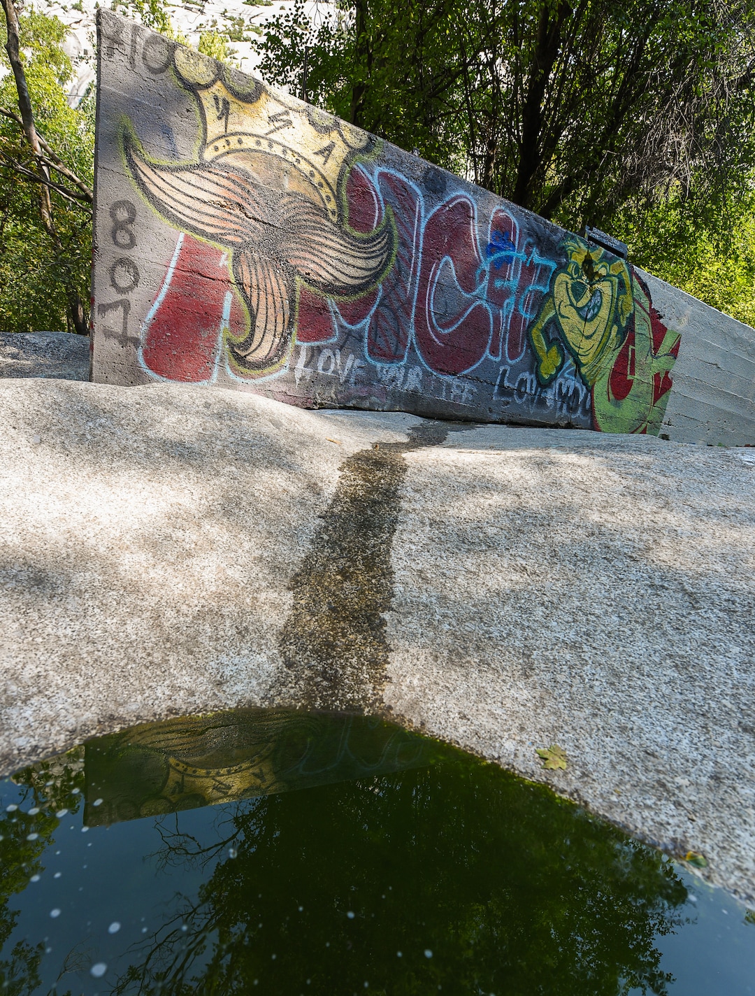 (Francisco Kjolseth  |  The Salt Lake Tribune)  Graffiti has proliferated in lower Little Cottonwood Canyon, where vandals, often wielding cans of fluorescent-colored spray paint, have covered granite faces, trees and structures. The vandalism is particularly apparent along the Temple Quarry Trail and the creek at the Moon Rock swimming hole and former pavilion site. Volunteers using donated equipment and solvents spend thousands of hours removing the paint from the rocks only to see graffiti return to the same faces or on rock nearby.