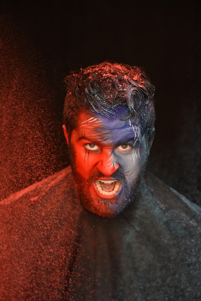 (Francisco Kjolseth | The Salt Lake Tribune) BYU and Utah fan alike Brad Klekas of South Jordan shows his mutual admiration by stepping into the Tribune studio to get both colors in anticipation of the upcoming match up between the two rival teams on Saturday.