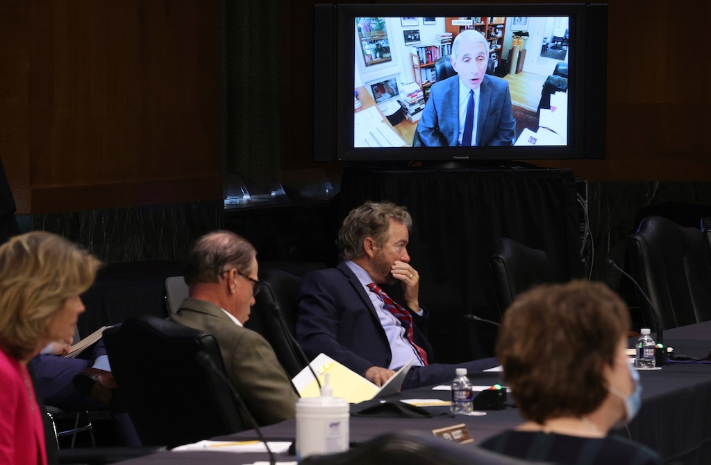 (Win McNamee | Pool via AP) Senators listen as Dr. Anthony Fauci, director of the National Institute of Allergy and Infectious Diseases, speaks remotely during a virtual Senate Committee for Health, Education, Labor, and Pensions hearing, Tuesday, May 12, 2020 on Capitol Hill in Washington. Seated from left are Sen. Lisa Murkowski, R-Alaska, Sen. Mike Braun, R-Ind., center, and Sen. Rand Paul, R-Ky.