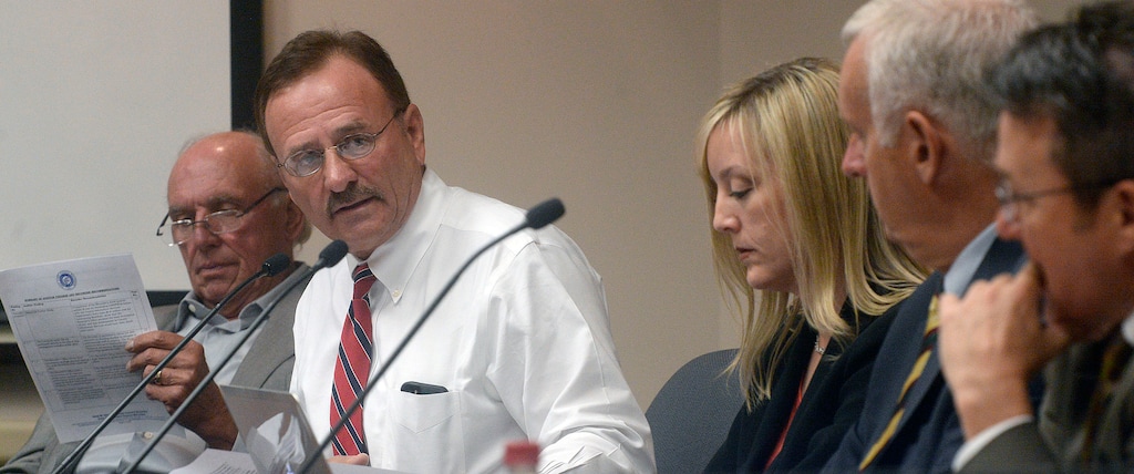 (Al Hartmann  |  Tribune file photo)
Salt Lake County Councilman Max Burdick, left, and other council members have a discussion, Oct. 4, 2016.