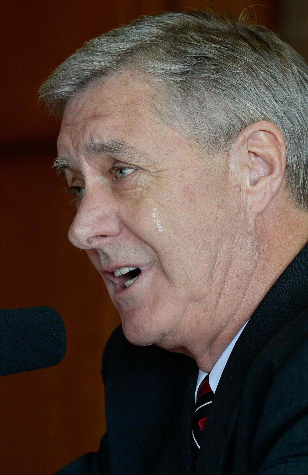 (Francisco Kjolseth  |  The Salt Lake Tribune)  University of Utah Athletics Director Chris Hill holds an emotional announcement to retire this spring after 31years. Joined by his wife Kathy and their kids and grandkids at the Jon M. Huntsman Center on campus on Monday, March 26, 2018, Hill is the longest actively tenured athletics director at the same school in the NCAA FBS.
