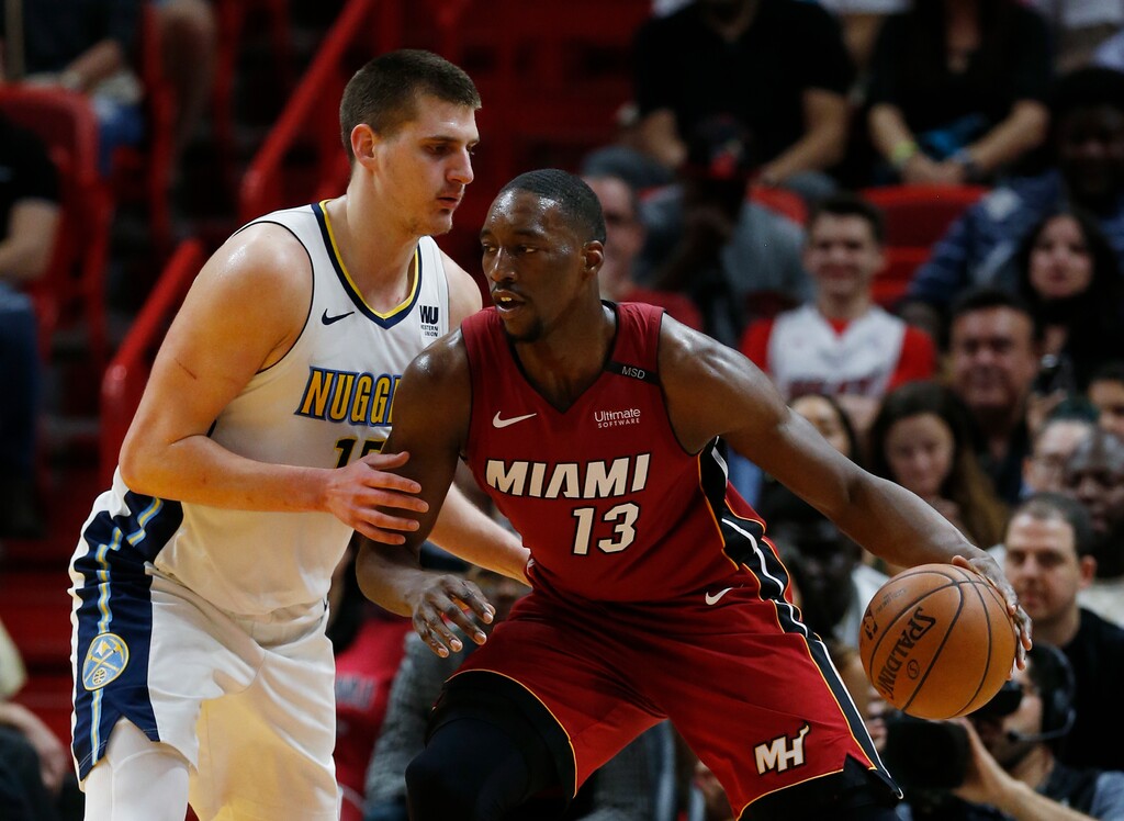 Miami Heat center Bam Adebayo (13) drives against Denver Nuggets center Nikola Jokic (15) during the first half of an NBA basketball game, Monday, March 19, 2018, in Miami. (AP Photo/Wilfredo Lee)