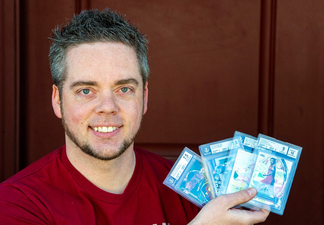 (Rick Egan  |  The Salt Lake Tribune)   Robert Kreib holds some of the RSL cards he trades with people around the country, Tuesday April 7, 2020