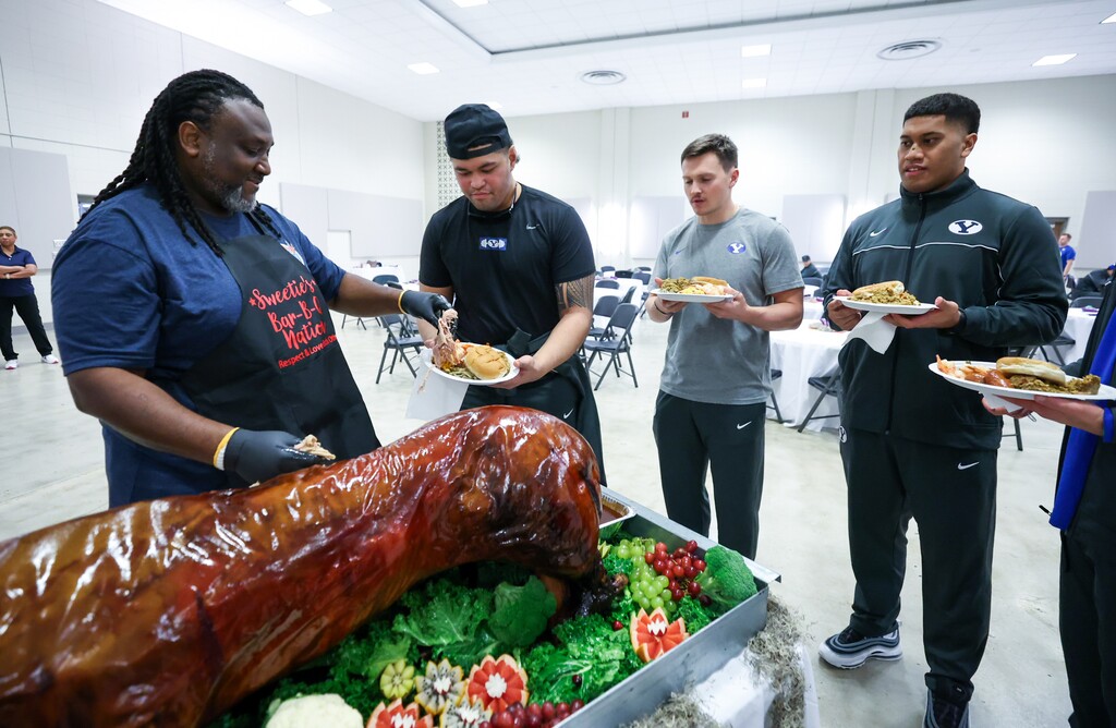 (Jaren Wilkey | BYU) The BYU Football team participates in the welcome dinner at the Independence Bowl in in Shreveport, La., Dec. 14 2021.