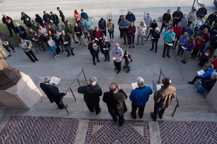 (Rick Egan  |  The Salt Lake Tribune)     Members of Christian denominations meet at the Cathedral of the Madeleine as they participate in the annual Good Friday procession through downtown Salt Lake City, Friday, March 30, 2018. The procession commemorating Christ's path to crucifixion has been a tradition of the Salt Lake Council of Churches since 1988. 


