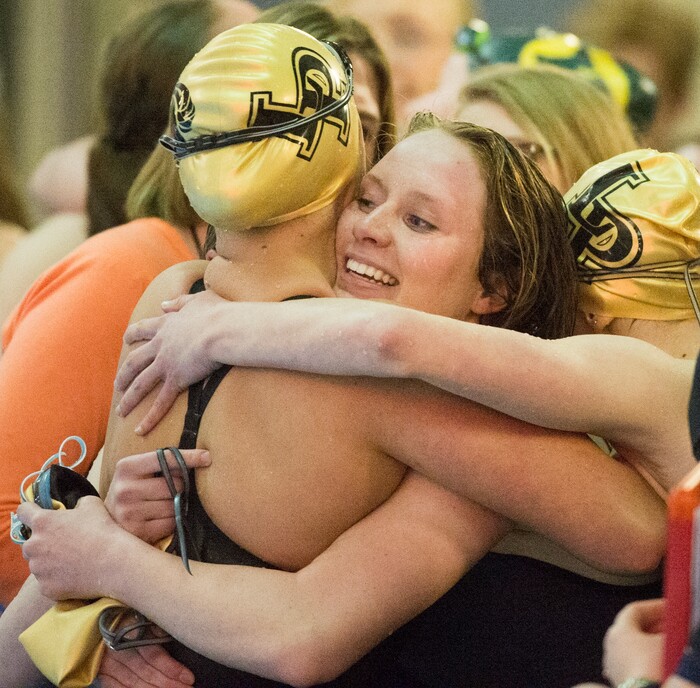 (Rick Egan  |  The Salt Lake Tribune)    Lone Peak Swimmer, Summer Shreeve gets a hug from Taylor McAleavy, after Lone Peakls first place finish in the Women's 500 Yard Freestyle Relay, in 6A State Swimming Championships in Bountiful, Friday, February 9, 2018.