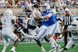 BYU quarterback Bear Bachmeier (47) throws the ball under pressure from the Georgia Tech defense during the first half of the Pop-Tarts Bowl NCAA college football game Saturday, Dec. 27, 2025, in Orlando, Fla. (AP Photo/Kevin Kolczynski)