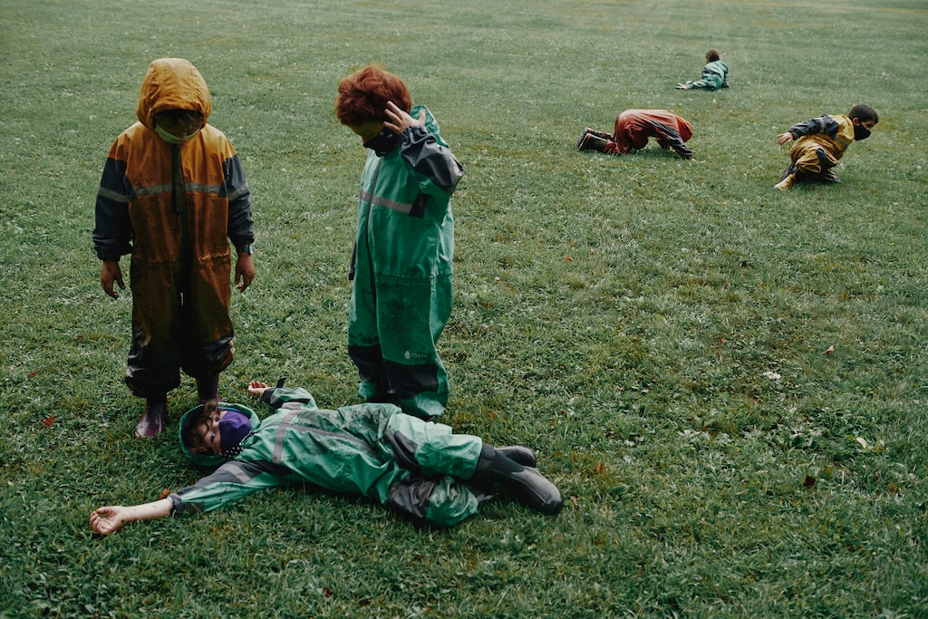 (Tony Luong | The New York Times) Students wear Oaki rain suits during class outside at Center School in Greenfield, Mass., Sept. 2, 2020. Some outdoor-oriented companies are starting new product lines or repurposing existing ones to capitalize on how the pandemic has changed the normal educational experience.