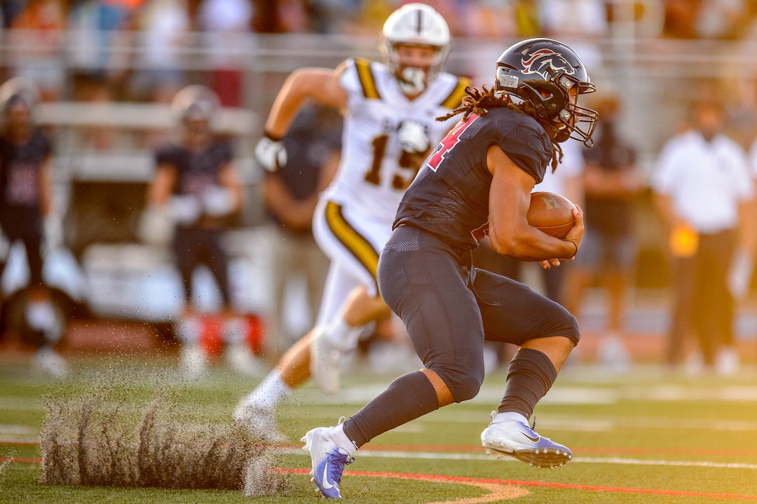 (Trent Nelson  |  The Salt Lake Tribune) Herriman's Nu'u Tafisi runs the ball as Herriman hosts Davis High School football, in Herriman on Thursday, Aug. 13, 2020.
