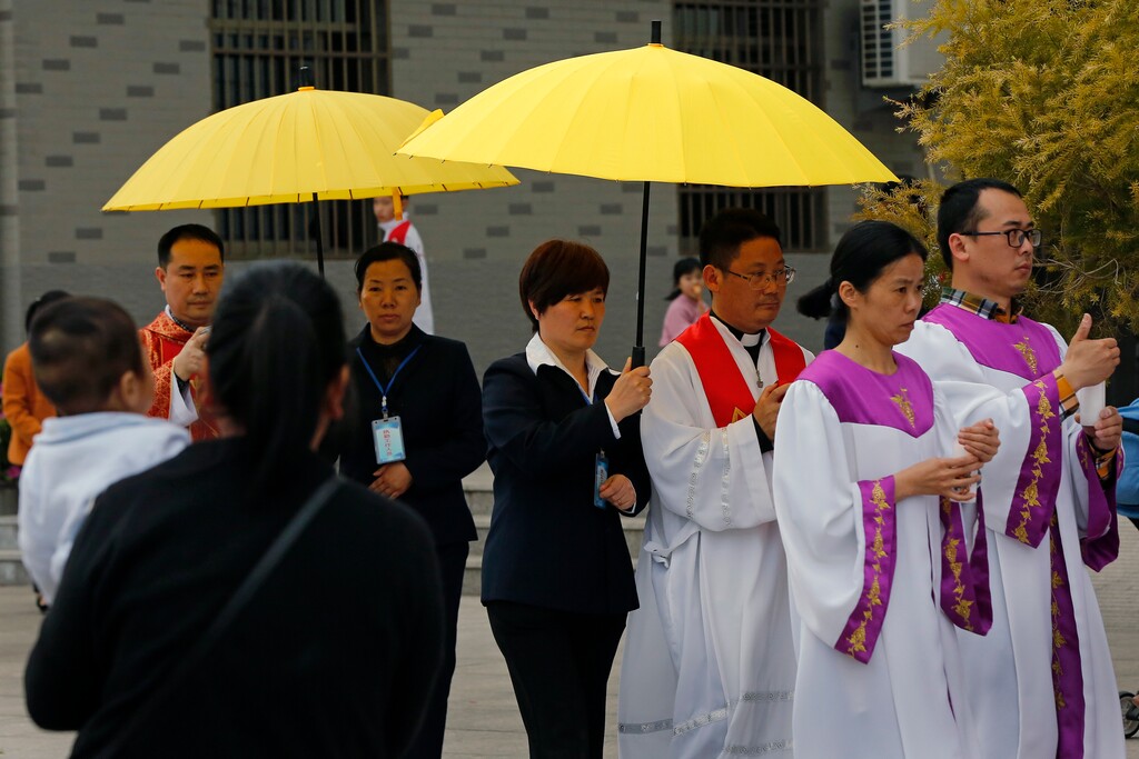 (Andy Wong | The Associated Press) Priests and their followers perform a procession during a Good Friday service at the Mindong underground Catholic church in Saiqi in southeast China's Fujian province, Friday, March 30, 2018. Good Friday celebrations in one Chinese parish had a conspicuous absence: their bishop, who just the day before was whisked away by the government. The bishop, Guo Xijin is at the center of talks between the Vatican and the atheist Communist Party that are expected to yield a historic deal on who appoints bishops in China and unite the country’s Catholics for the first time since Beijing and the Holy See severed relations nearly seven decades ago.