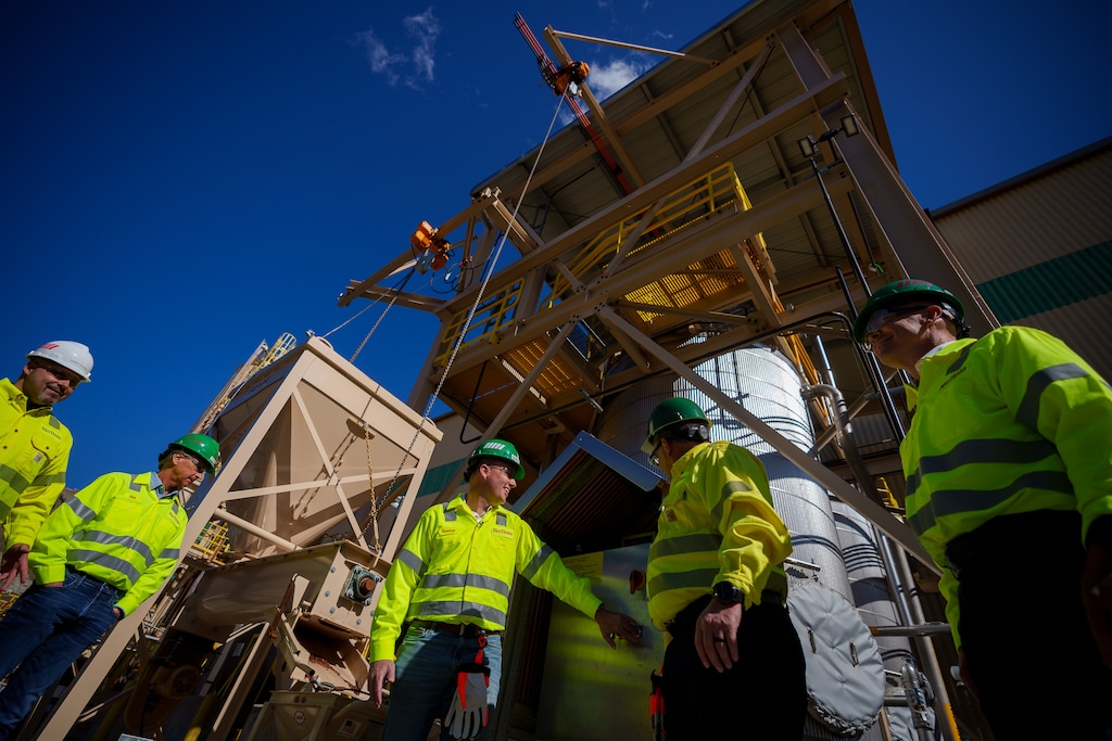 (Trent Nelson  |  The Salt Lake Tribune) Gov. Spencer Cox activates machinery at an event announcing that Rio Tinto has started producing tellurium at its Kennecott copper operation, on Wednesday, May 11, 2022.