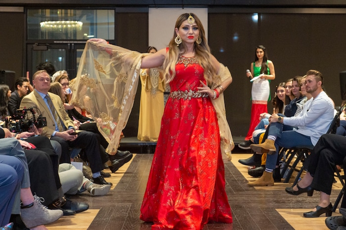 (Rick Egan | The Salt Lake Tribune) Millie Rivera walks the runway, during the 9th annual Women of the World Fashion Show Gala, Wednesday, March 6, 2019.