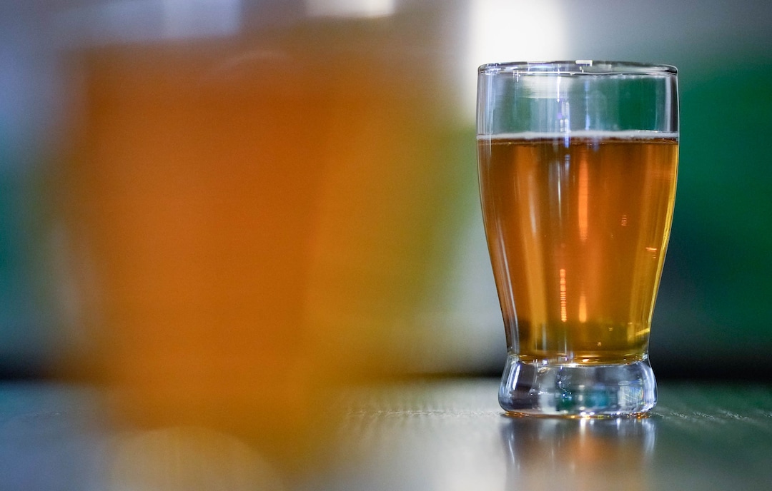 (Francisco Kjolseth | The Salt Lake Tribune) People enjoy samples of beers at Hopkins Brewery, the first stop of four on the City Brew Tour in Salt Lake City on Saturday, April 30, 2022. The tours, new educational beer tours that take folks around to local breweries to see the back end of the brewing process, sample beers and pair them with food. 